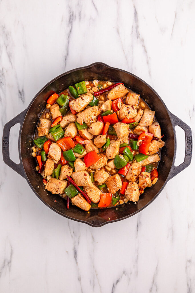 cooking kung pao chicken in skillet