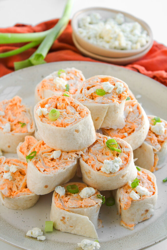buffalo chicken pinwheels on white plate