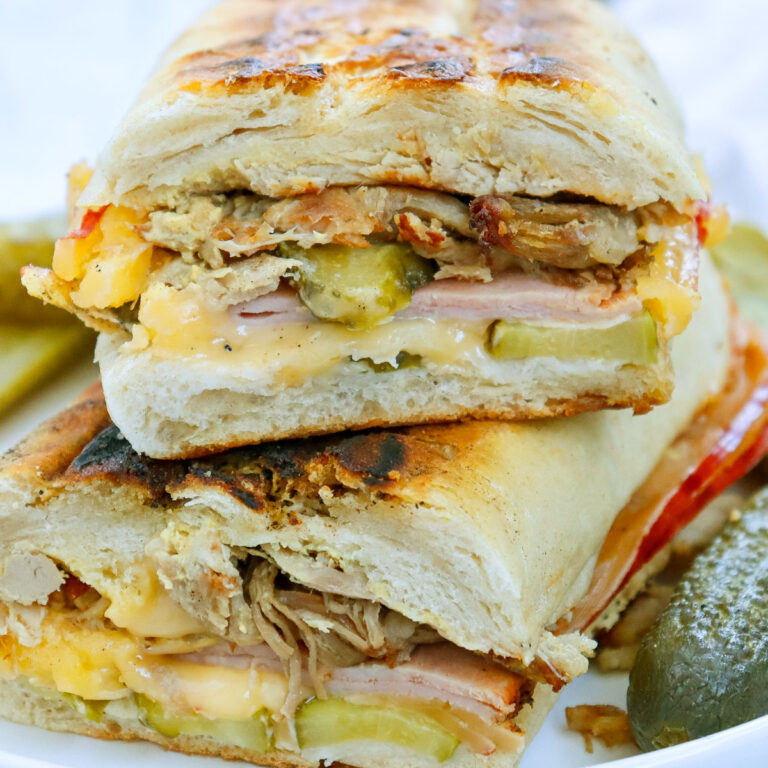 stacked Cuban sandwich on plate