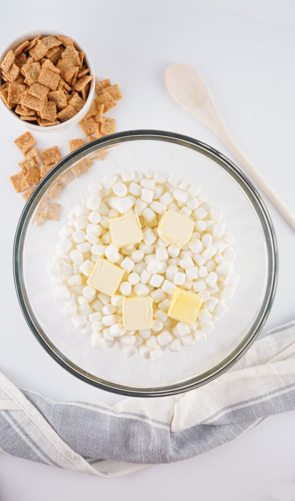 marshmallows and butter pats in glass bowl for cinnamon toast crunch treats