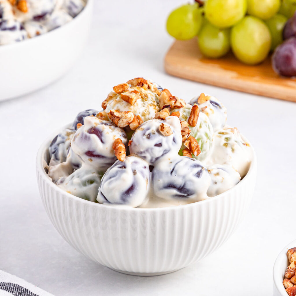 grape salad in small white bowl