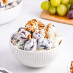 grape salad in small white bowl