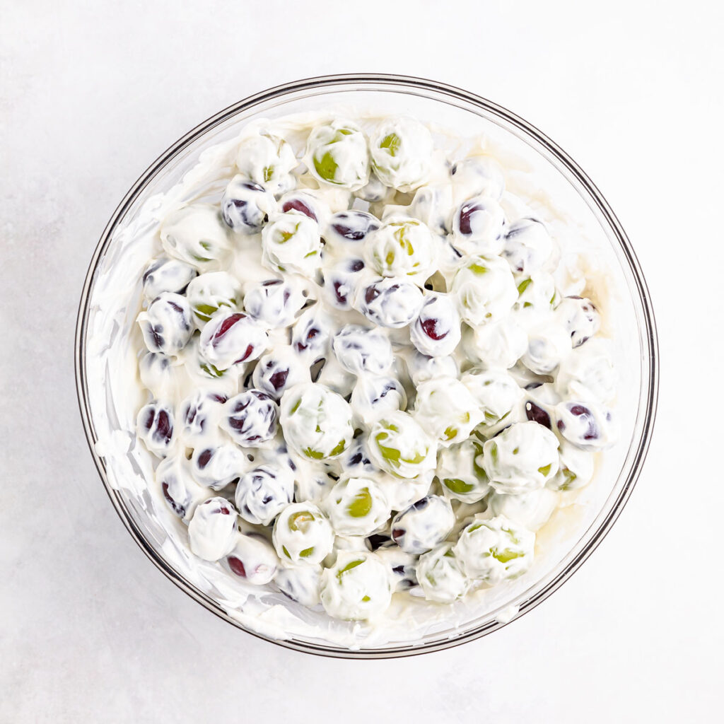creamy grape salad in glass bowl