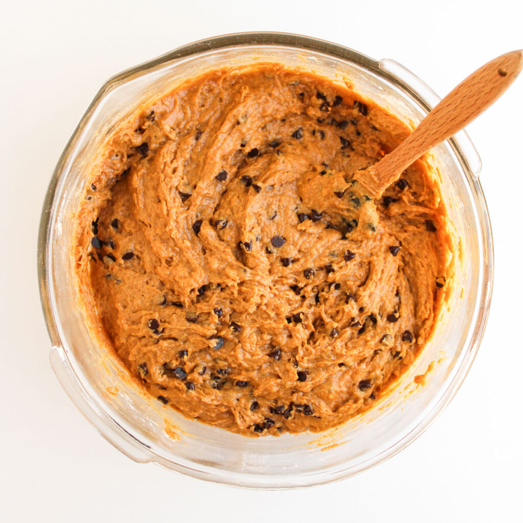 mixing pumpkin chocolate chip muffins batter