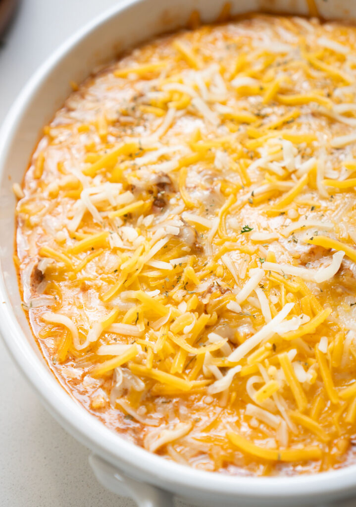 enchilada dip in white serving dish
