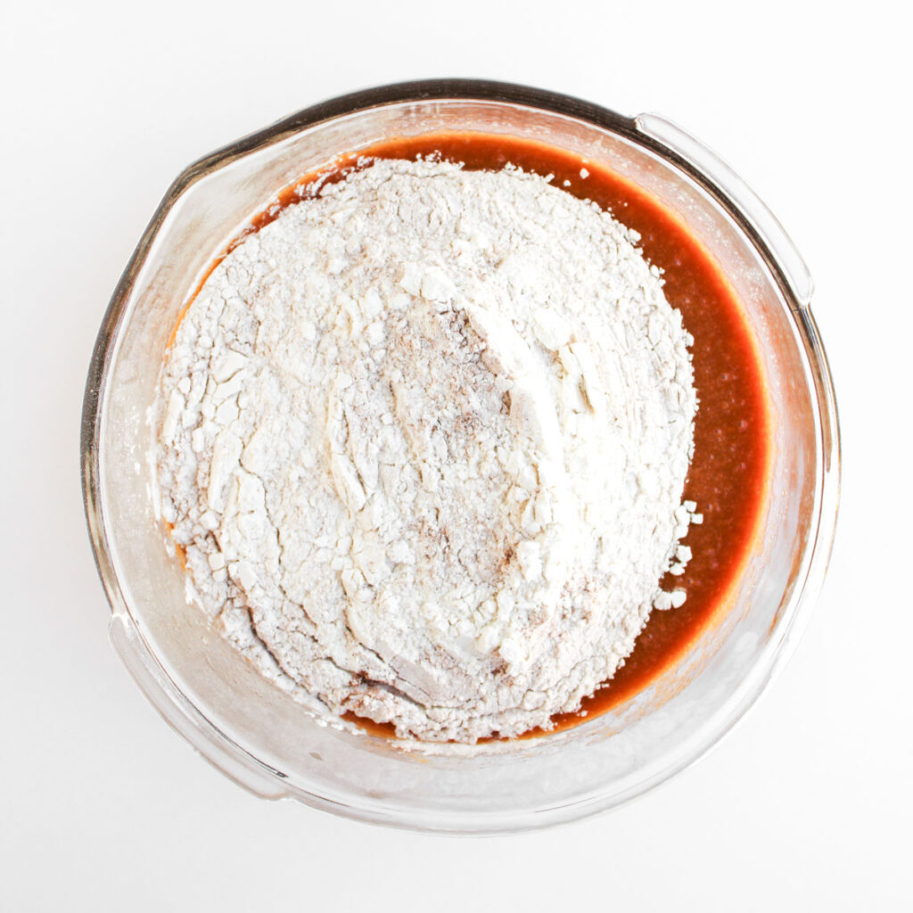 flour and pumpkin for pumpkin chocolate chip muffins batter