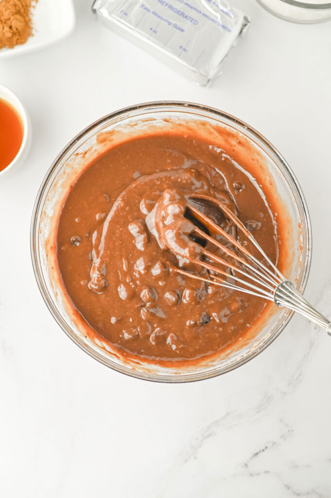mixing pumpkin brownies batter