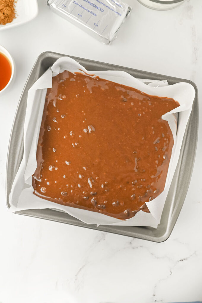 pumpkin brownies batter in pan