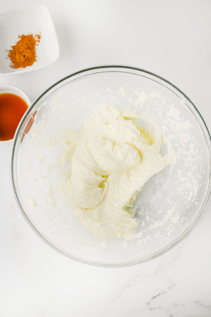 whipping cream cheese in glass bowl