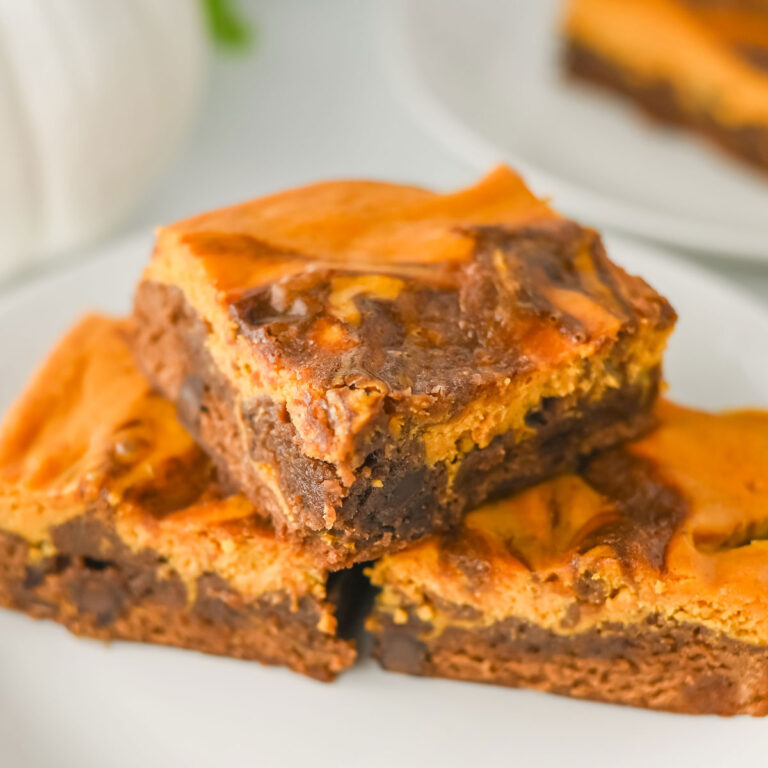3 slices of pumpkin brownies on white plate