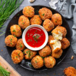 potato bites on plate with marinara