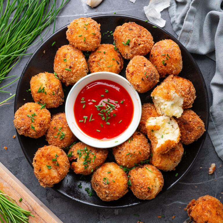potato bites on plate with marinara