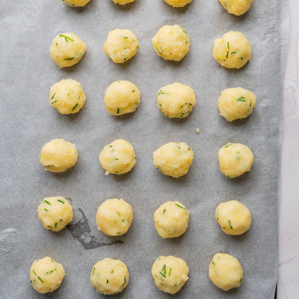 mashed potato balls on cookie sheet