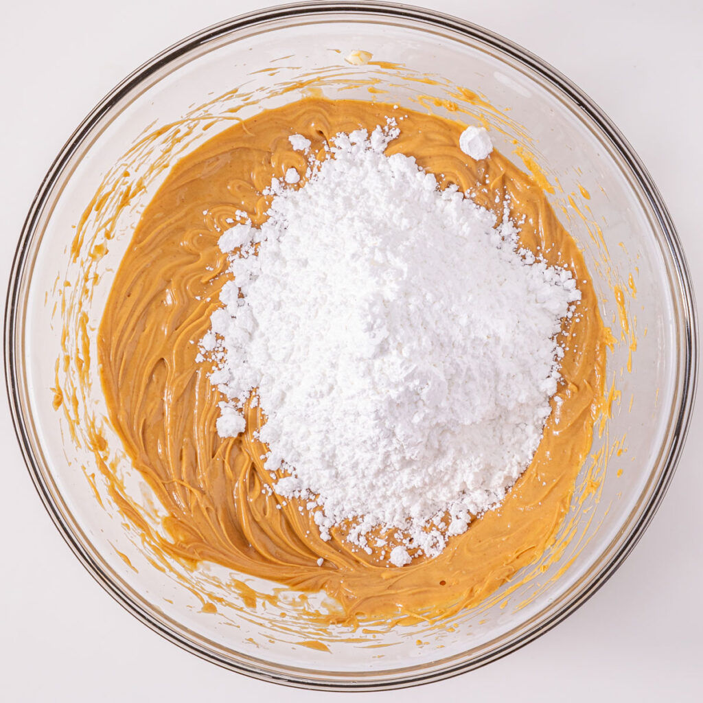 peanut butter and powdered sugar in glass bowl