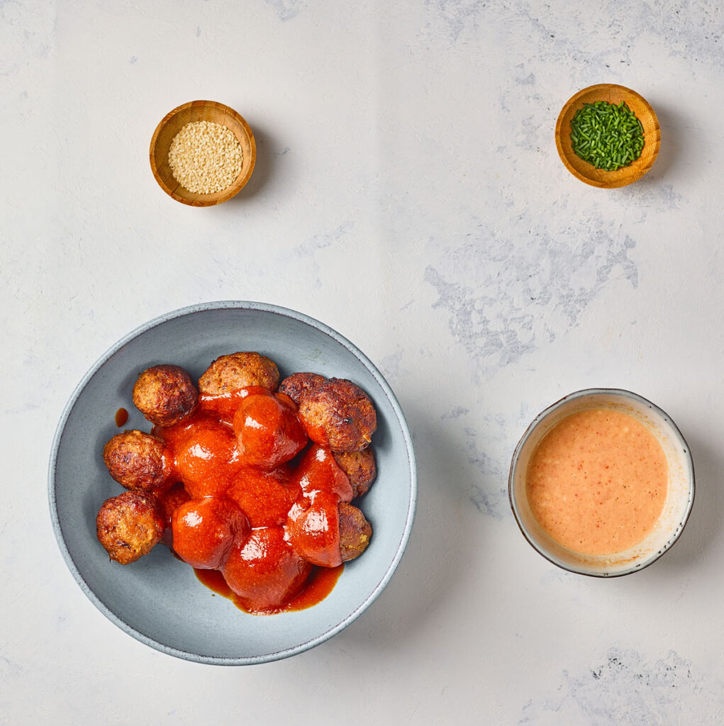 korean meatballs and sauce in bowls