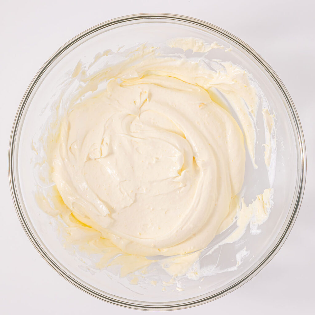 whipped cream in glass bowl