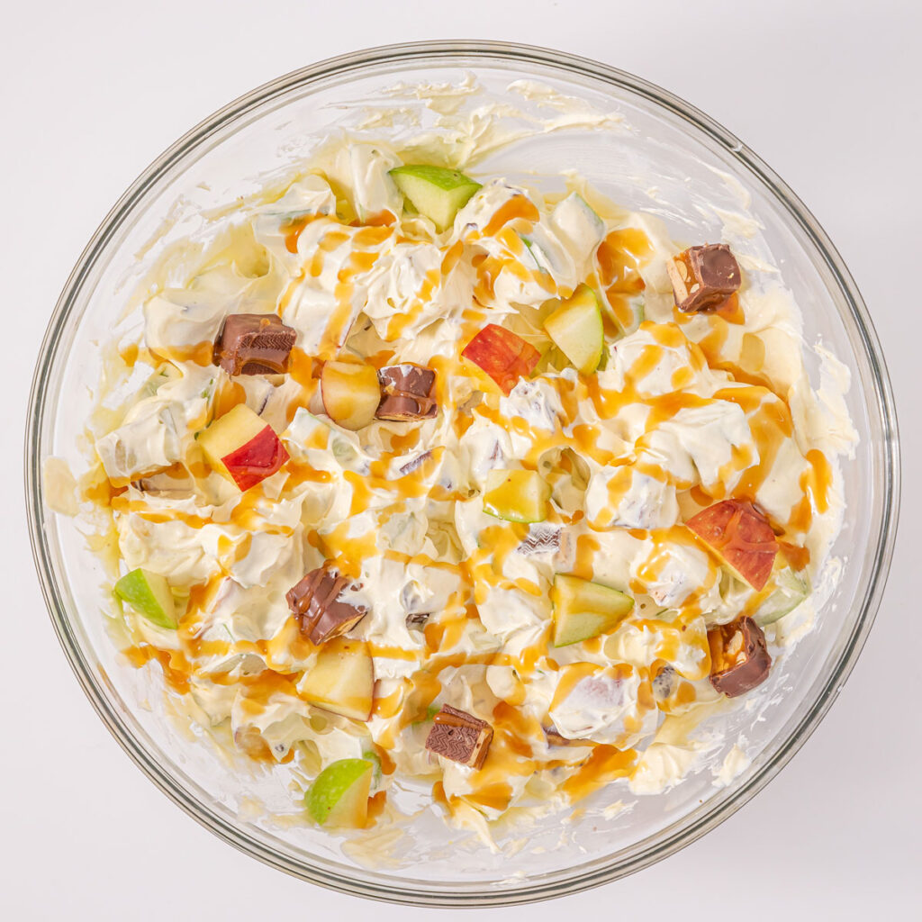 glass bowl with snickers apple salad