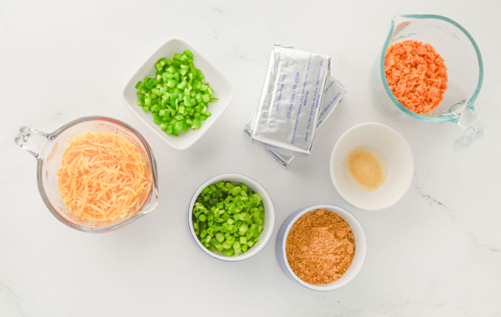 taco cheeseball ingredients in bowls on countertop