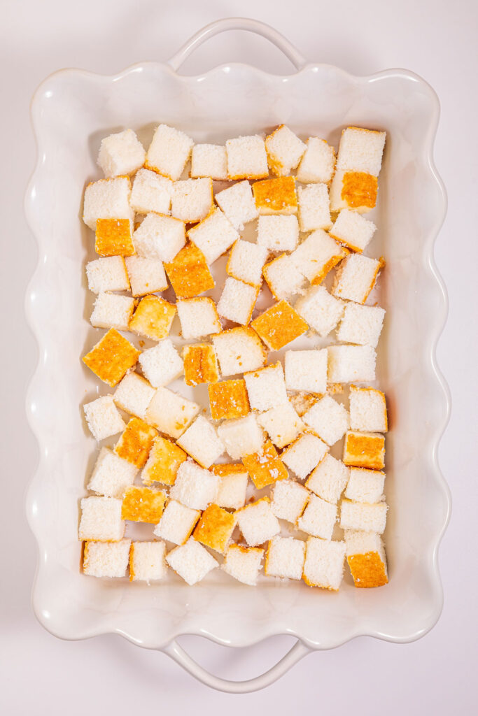 cubes of angel food cake in casserole dish