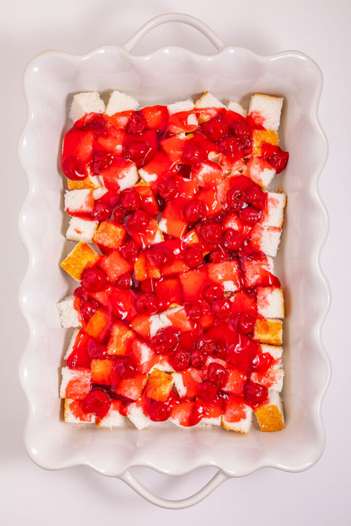 cherry pie filling over the top of angel food cake cubes