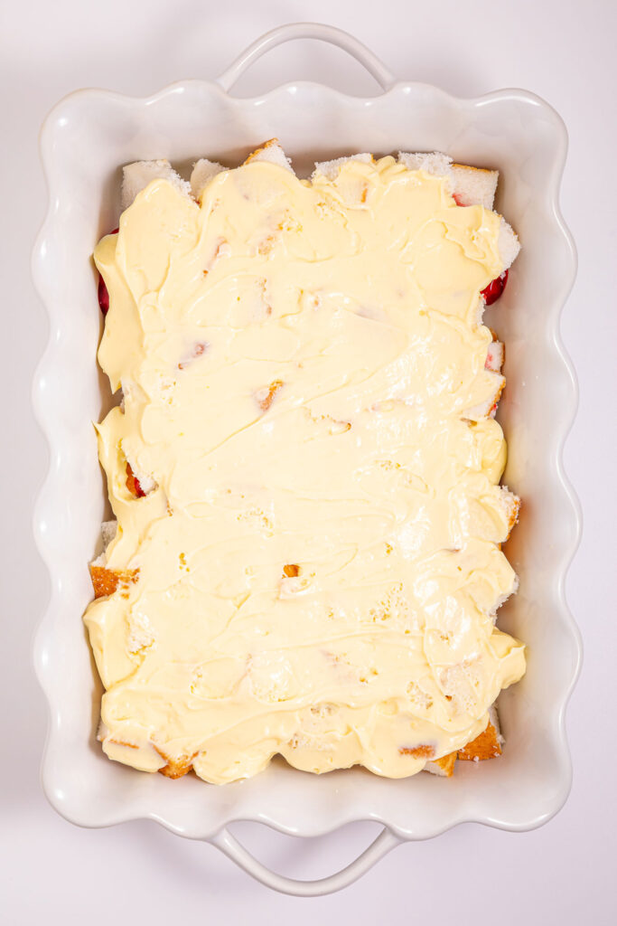 layering custard for heaven on earth cake