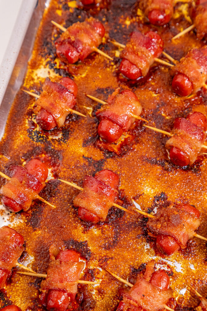 bacon wrapped little smokies on baking sheet