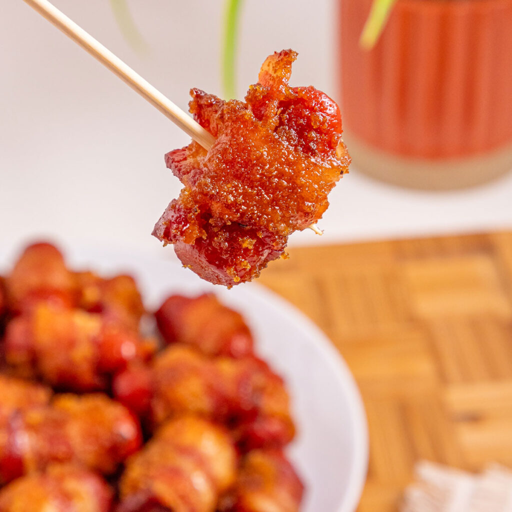 bacon wrapped little smokie on skewer