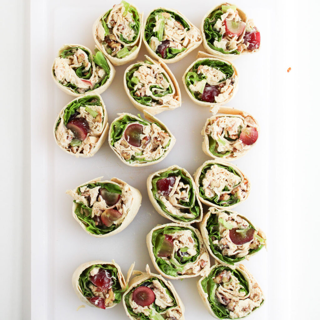chicken salad pinwheels on cutting board