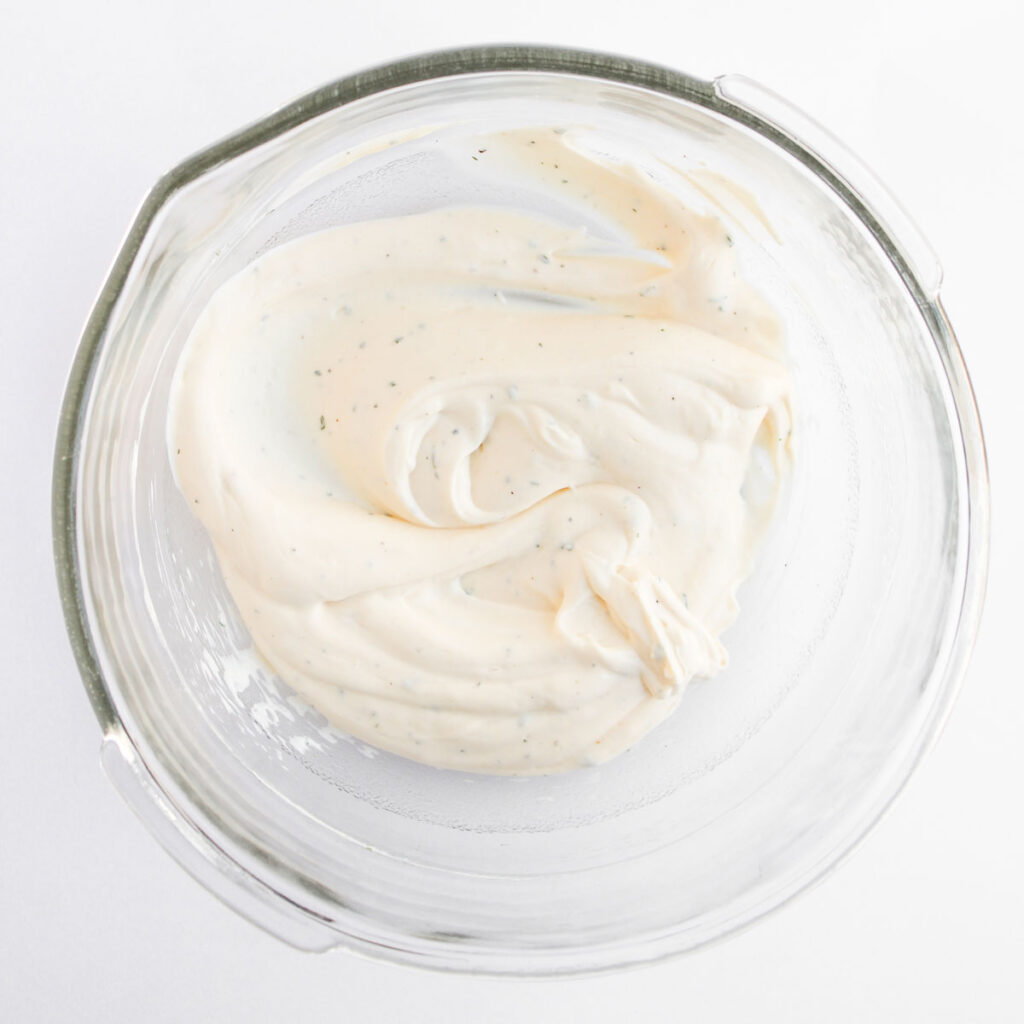 pasta salad dressing in glass bowl