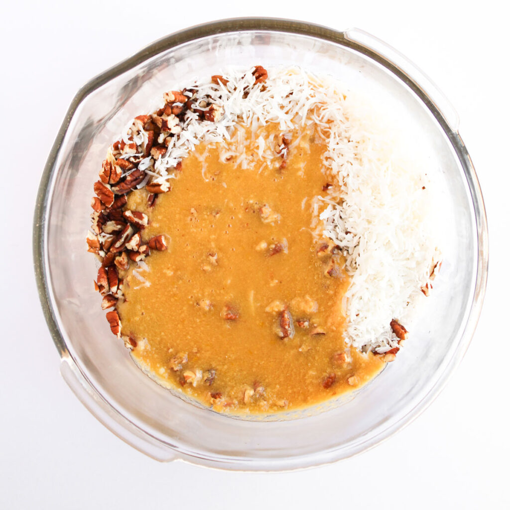 german chocolate frosting ingredients in glass bowl