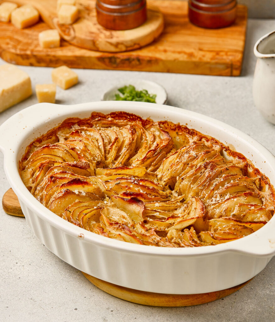 scallop potatoes in white baking dish