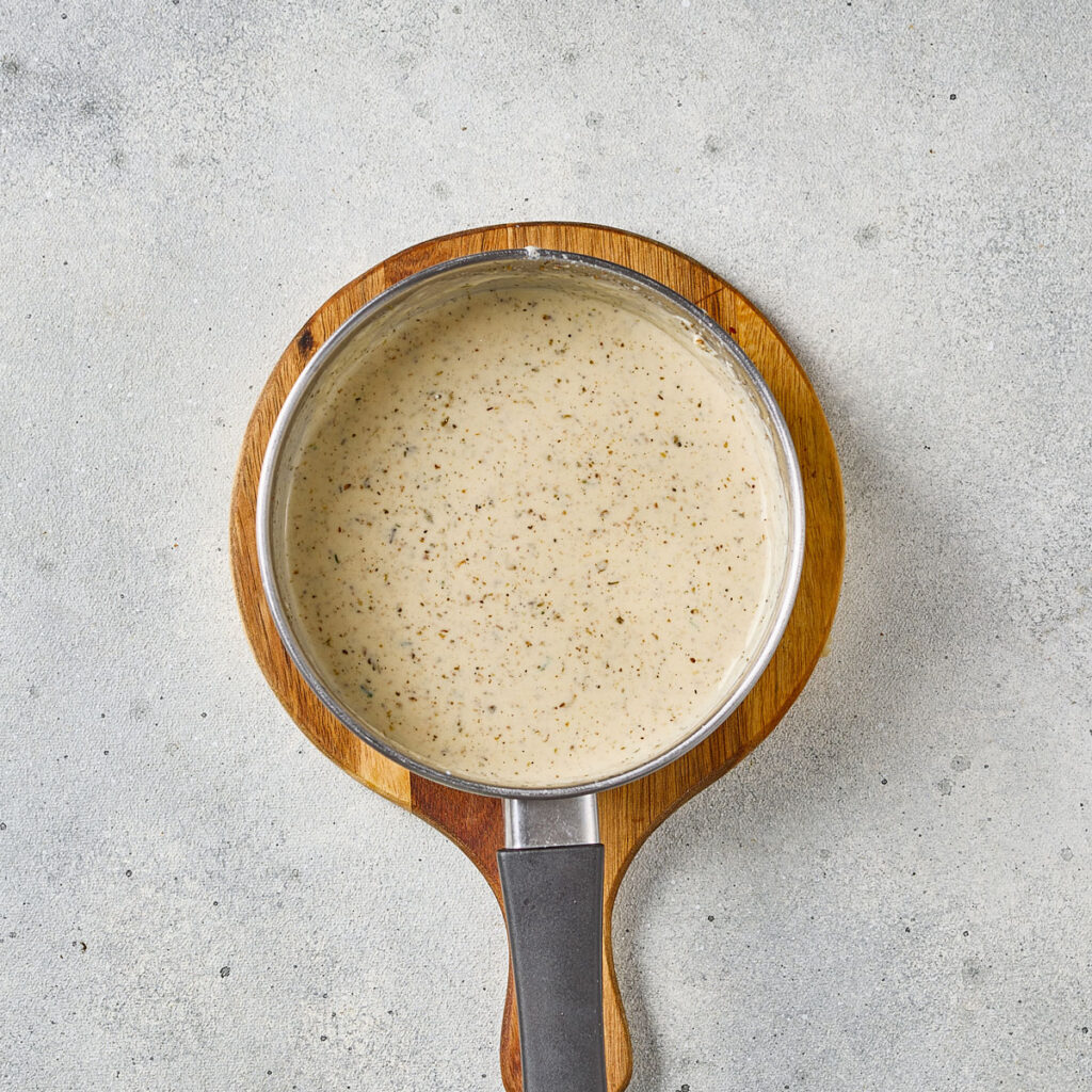 scallop potatoes sauce in saucepan